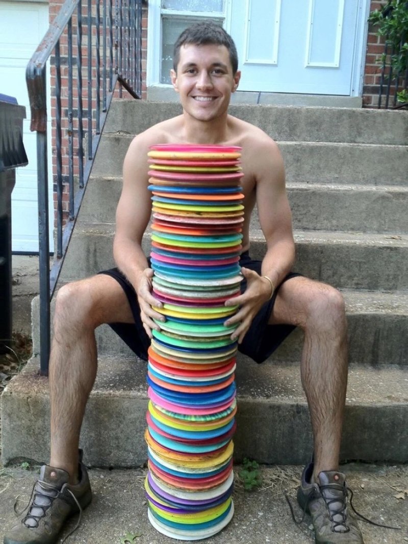 A man who found 73 frisbees in a pond while looking for his own