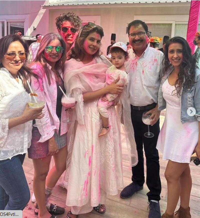 Priyanka Chopra and Nick Jonas danced to the beats of the dhol at the Holi party, while holding Malti in their arms.